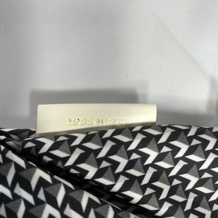 ROBERTA PIERI's black and white geometric mini duffel fabric with a white label that reads "MADE IN ITALY" in gold letters. The background is plain white.