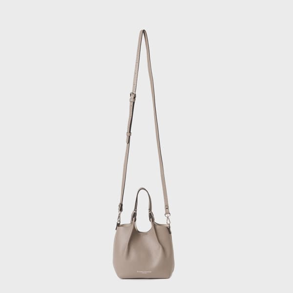 Against a plain light gray background, a GIANNI CHIARINI handbag in top-leather.